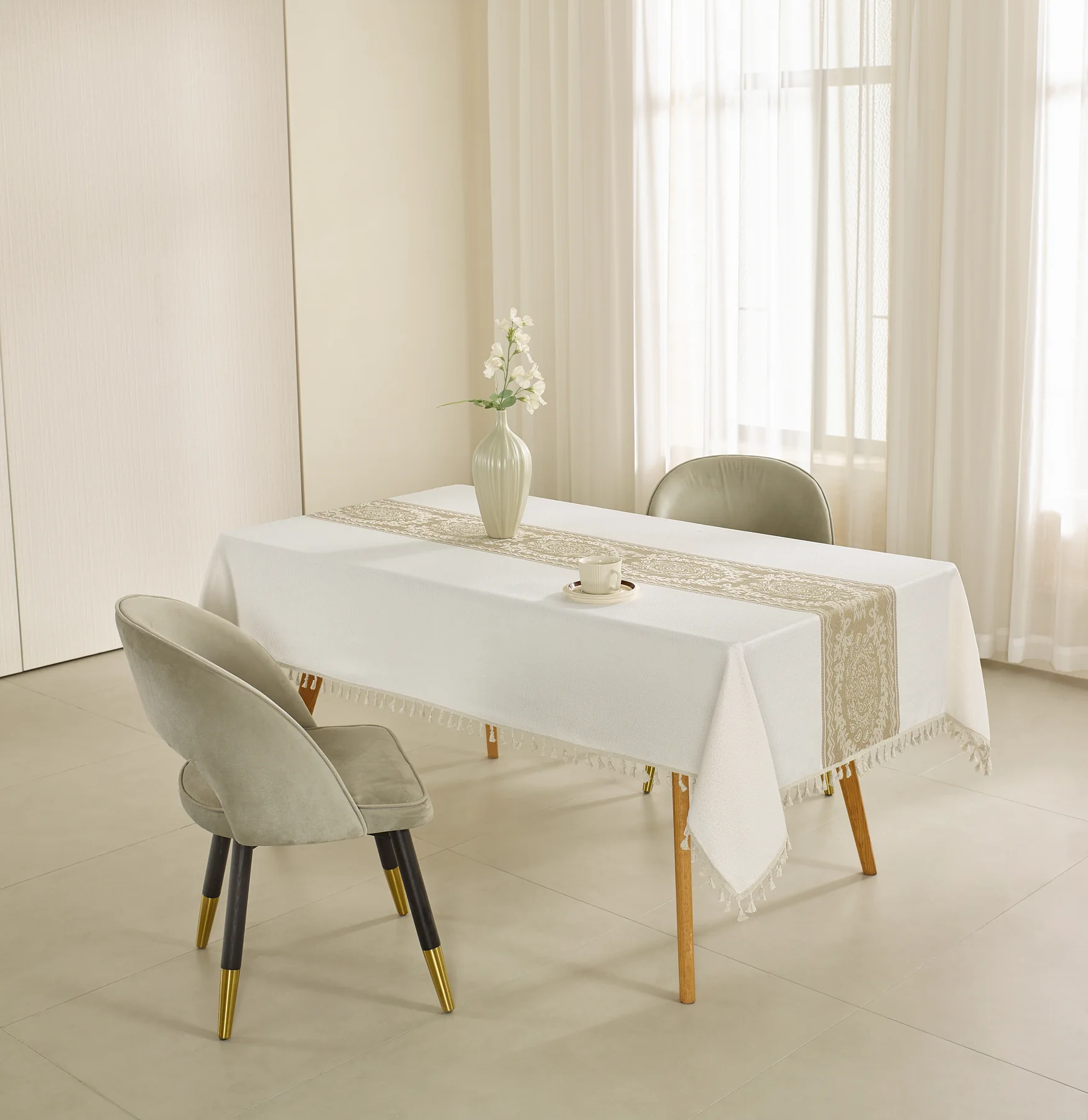 Elegant embroidered tablecloth in a styled dining setting