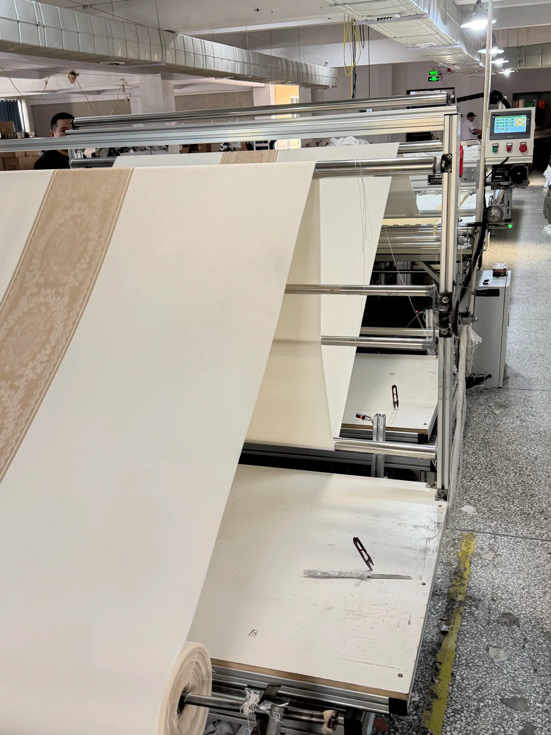 Automated fabric cutting and preparation equipment in the Danli production workshop