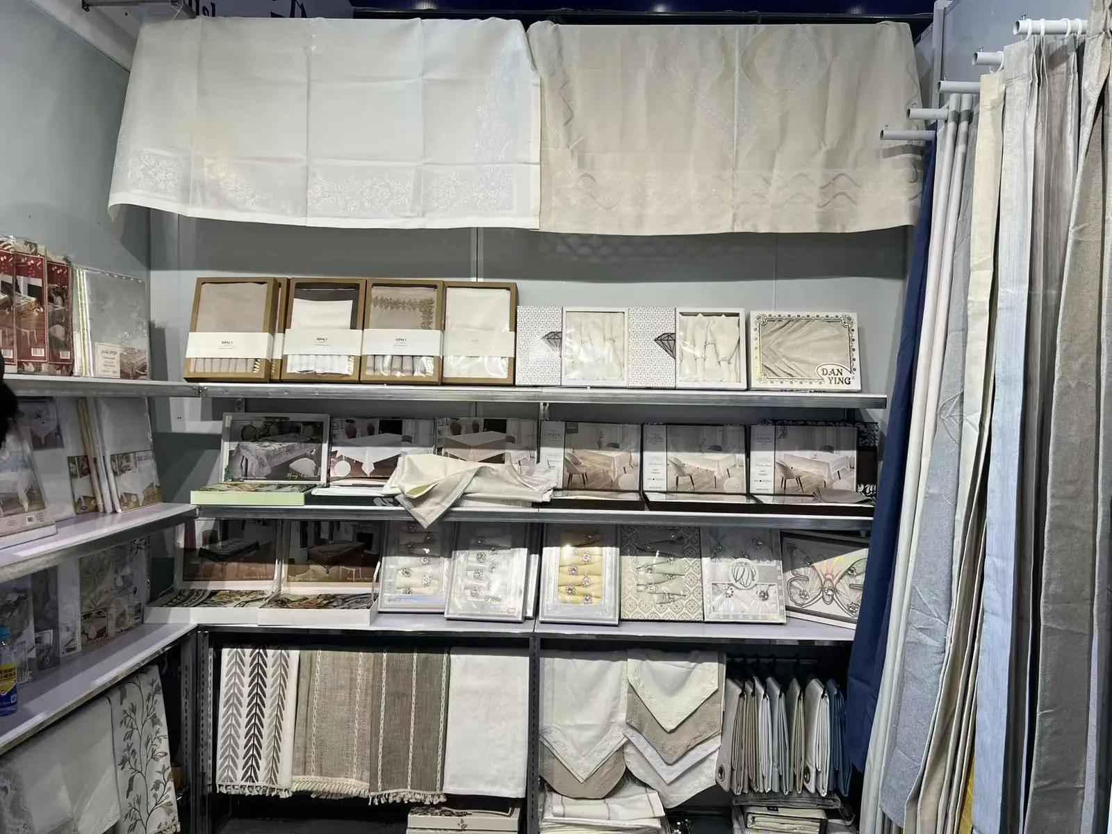 Tablecloth and napkin collections displayed at the Danli booth