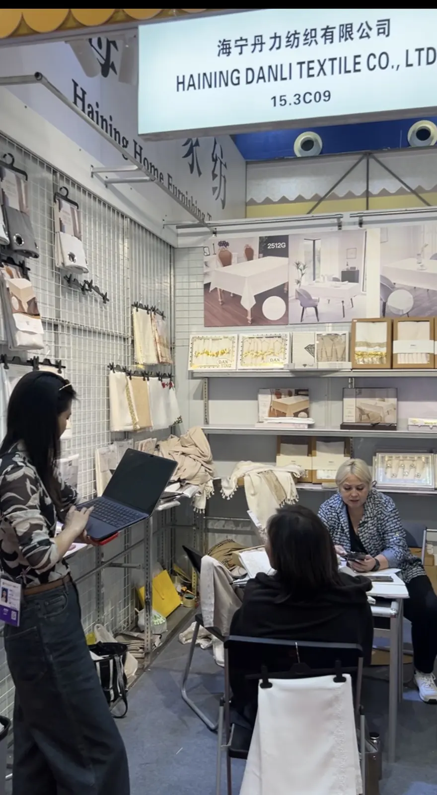 Business discussion inside Danli booth 15.3C09